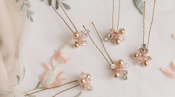 Rosie crystal pearl hairpins in rose gold by Laura Jayne Accessories on floral background