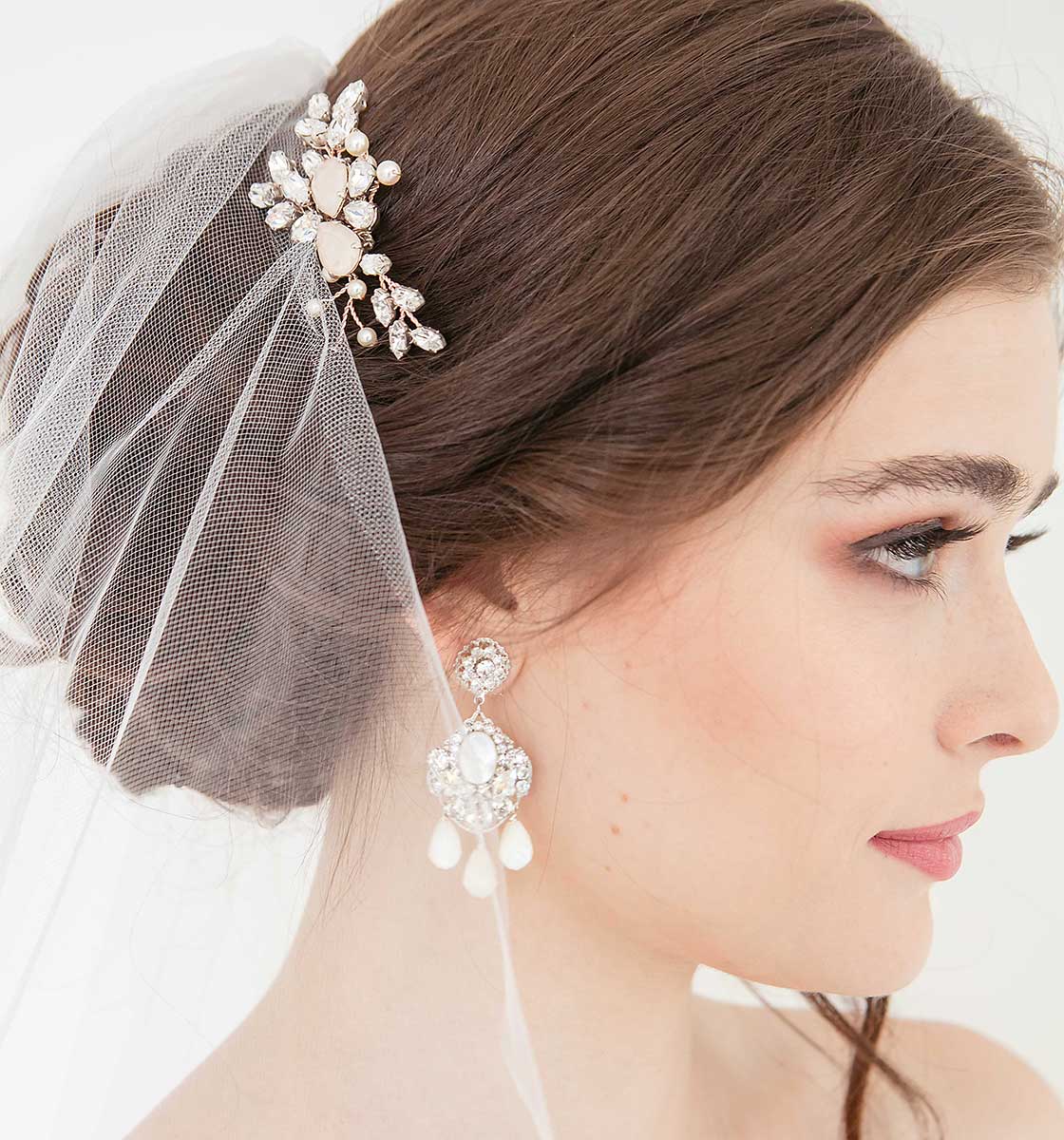 Laura Jayne Headpieces - profile of bride wearing vine hair comb and chandelier earrings