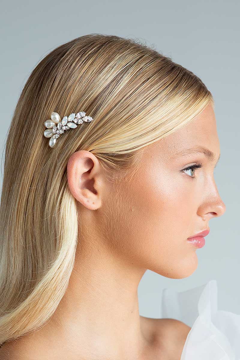 Head and shoulders of woman with small pearl opal crystal Laura Jayne Accessories comb tucked behind her ear