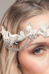 Close up of woman wearing draped chain bridal headpiece by Laura Jayne of Toronto Canada