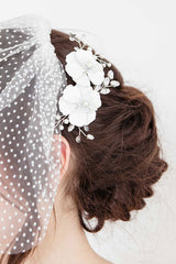 Close up of Giordana floral bridal come in up-do hairstyle