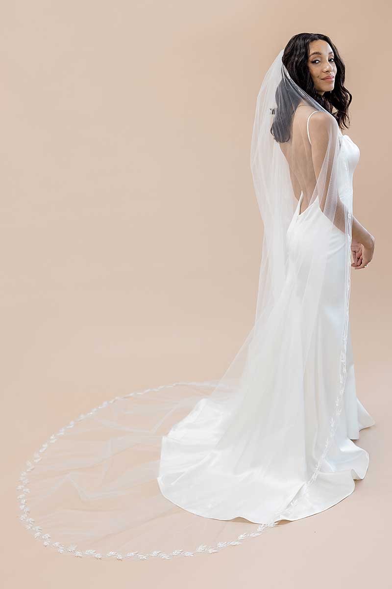 Full portrait of bride wearing nature-inspired embroidered cathedral veil Laurella by Laura Jayne Accessories Toronto