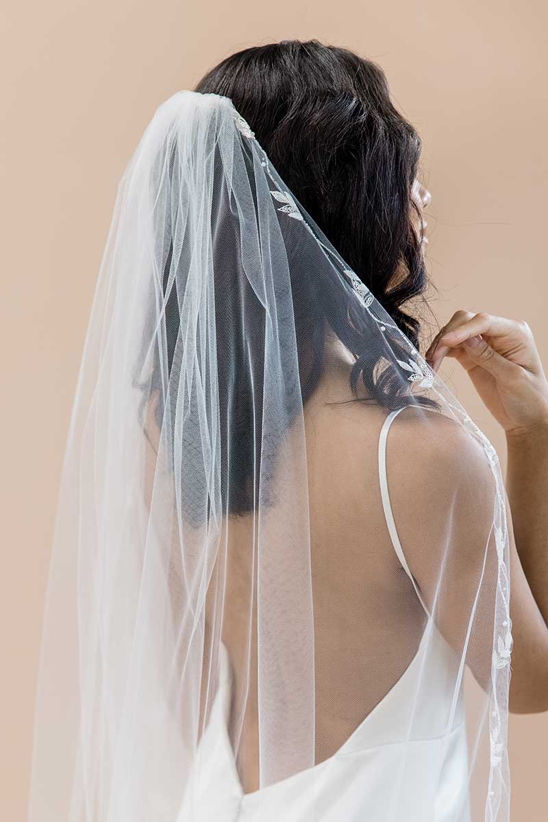Close-up back view head and shoulders of bride wearing embroidered cathedral veil Laurella by Laura Jayne Accessories Toronto