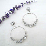 Statement hoop earrings for brides parties or nights out Large hoop earrings are adorned at the base with crystal stars and rhinestone balls