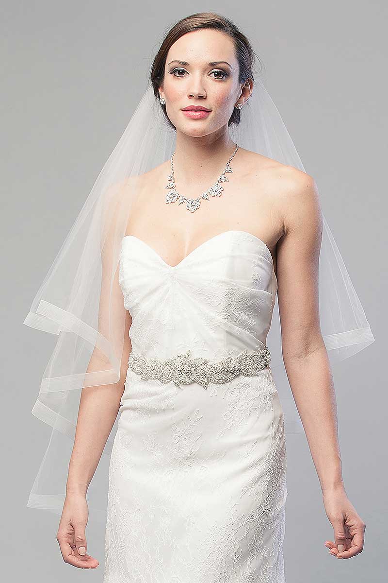 Bride-wearing-two-tier-Denyse-fingertip-length-horsehair-ribbon-veil by Laura Jayne Accessories Toronto.