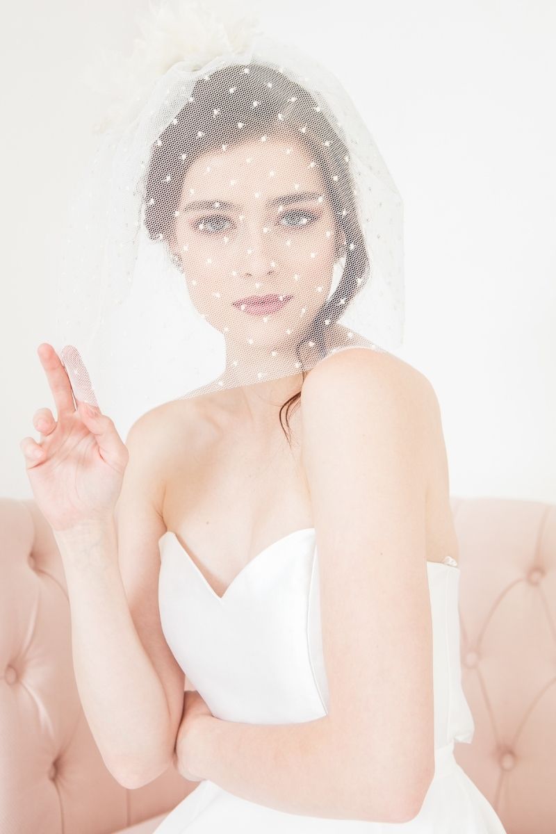 Modern bridal birdcage face veil with polka dots. Annie Birdcage Veil by Laura Jayne Accessories Toronto. Handcrafted in Canada. 