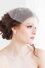 Bride wearing pearl, crystal and silver stud earrings. Bridal jewelry handmade in Canada. 