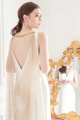 Backview of bride wearing gold chandelier earrings E7027 with glitter tulle cape by Laura Jayne Accessories