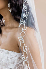 Close up of pearl vine embroidered detail on cathedral wedding veil. Espere by Laura Jayne