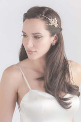 Head and shoulders of bride with hair down wearing Filippa gold leaf vine headpiece