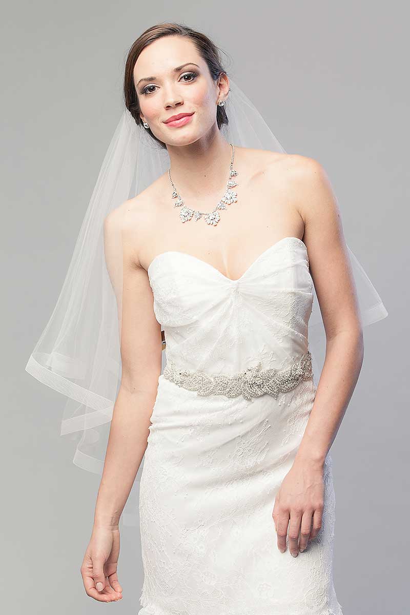 Bride wearing V2006 Denyse Fingertip Horsehair wedding veil by Laura Jayne Accessories Toronto.