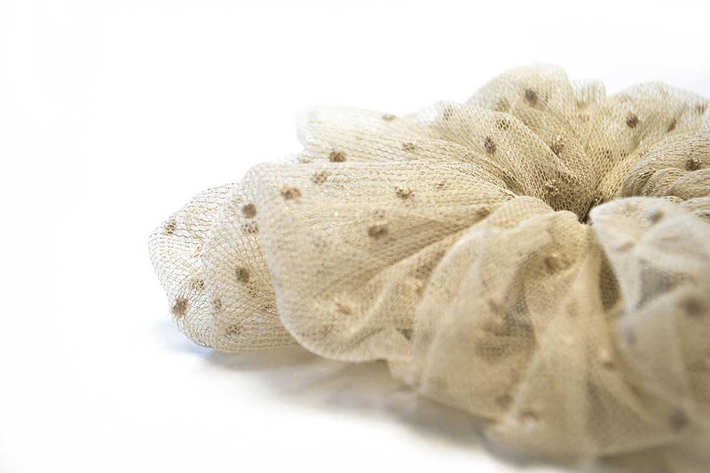 Close up view of gold dot tulle scrunchie hair tie handmade in Canada