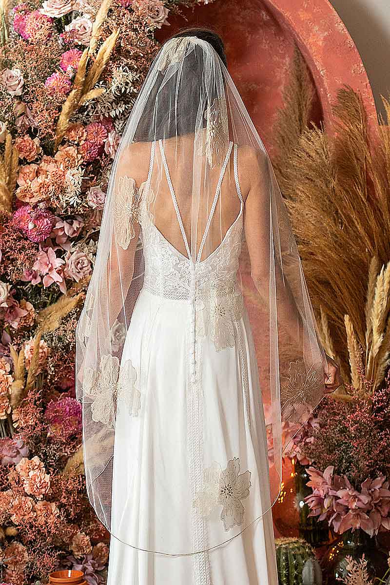 Back view of bride wearing Isla Gold Floral Waltz Wedding Veil draped over shoulders to show off gold metallic floral embroidery detail. Laura Jayne Accessories Toronto. Handcrafted in Canada. 