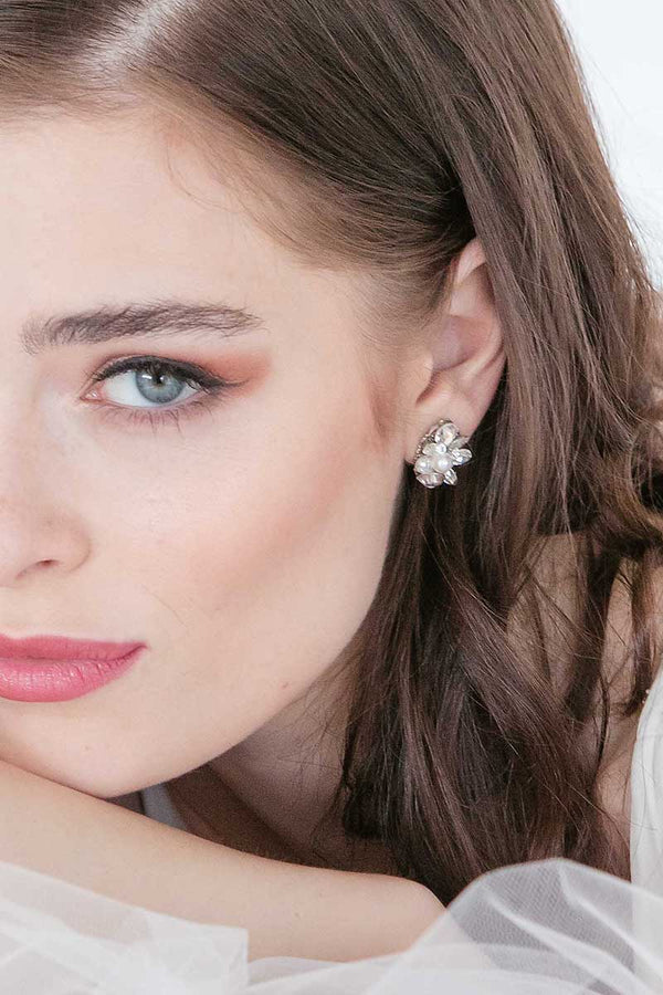 Close up of woman wearing crystal pearl stud earrings E7023 by Laura Jayne Accessories