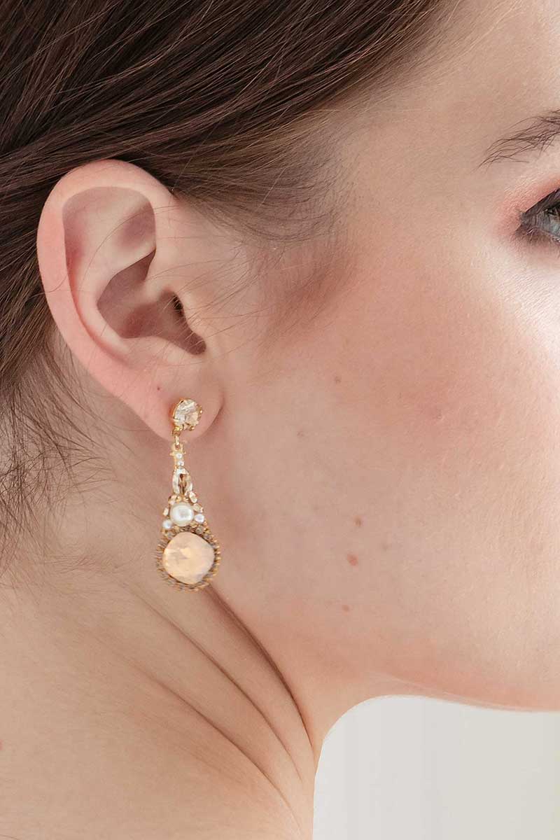 Profile of woman wearing Gold blush crystal cushion cut pendant earrings E7027 by Laura Jayne Accessories