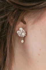Closeup of woman wearing pearl crystal opal drop earrings E9081 by Laura Jayne Accessories