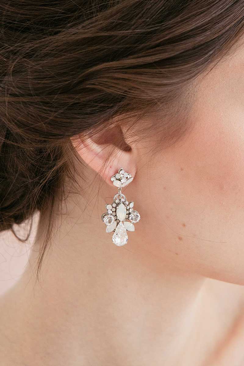 Profile of woman wearing opal pear chandelier earrings E9084 by Laura Jayne Accessories