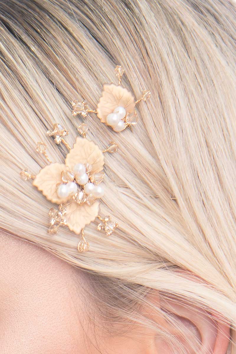 Close up of Laura Jayne Gilt Foliage hairpins in womans hair