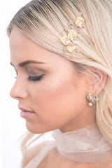 Profile of woman wearing gold leaf bridal hair pins by Laura Jayne Accessories