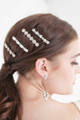 Profile of woman wearing Laura Jayne linear crystal barrettes and star hoop earrings