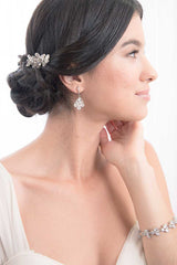 Head and shoulders of woman wearing low updo with Louisa crystal hairpins by Laura Jayne