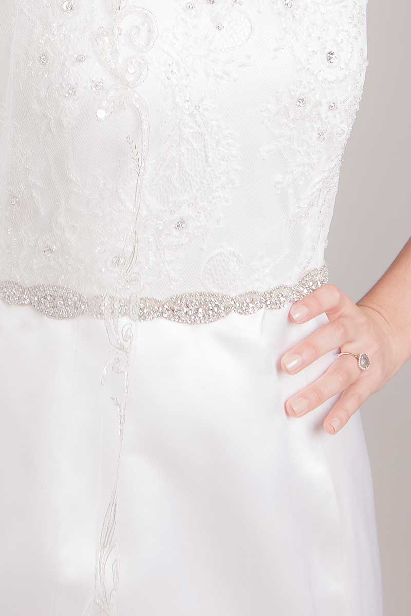 Close up of bride wearing Maggie crystal rondelle sash by Laura Jayne Accessories