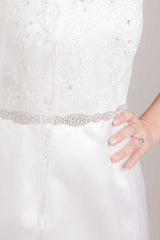 Close up of bride wearing Maggie crystal rondelle sash by Laura Jayne Accessories