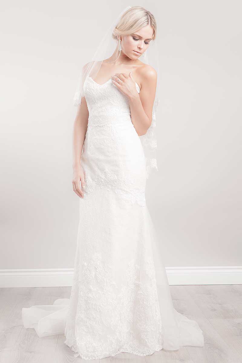 Bride wearing Laura Jayne Marlisa fingertip veil with lace trim. Laura Jayne Accessories Toronto, Canada. 
