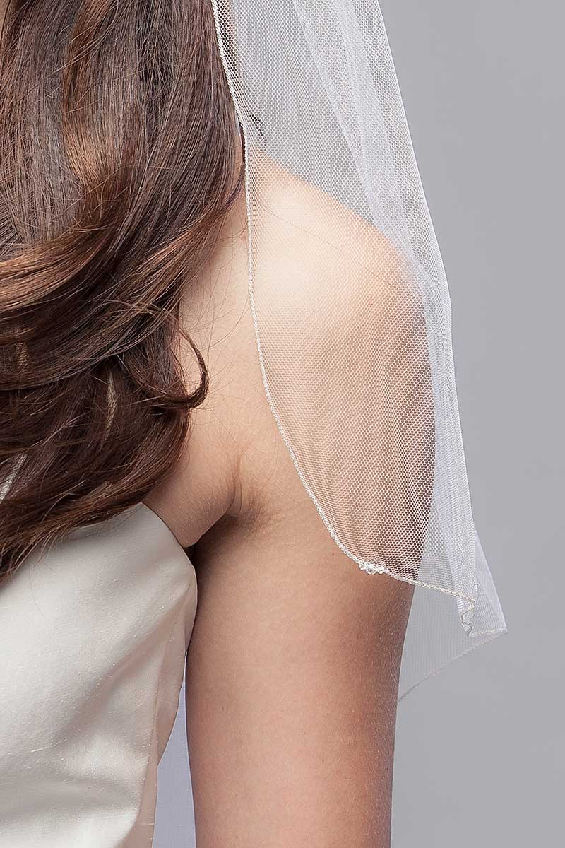 Close up of crystal detail and micro metallic edge. Edge available in gold or silver as shown. Laura Jayne Embrace Cascade Fingertip Veil made in Toronto, Canada.