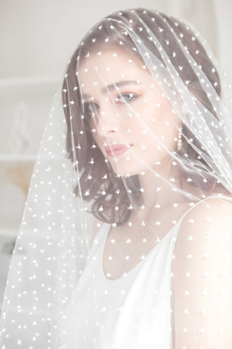 Toronto Bride in fingertip length polka dot veil. Handmade in Canada. Bridal Fashion Trend.