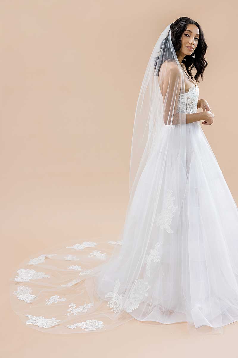 Profile of bride wearing statement lace train cathedral veil Seine by Laura Jayne Accessories Toronto