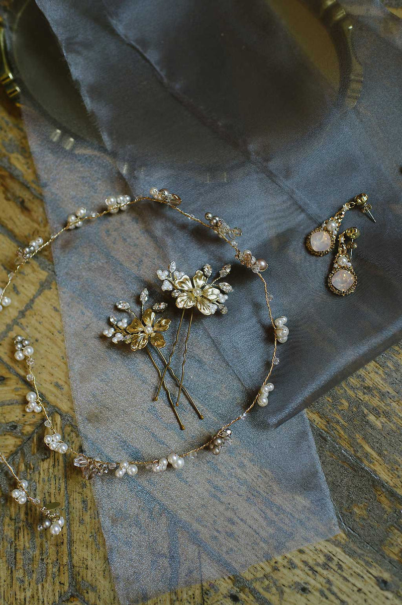 Gold wedding accessories flatlay with Laura Jayne Marisol vine