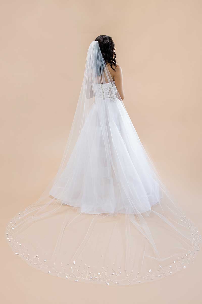 Back view of bride wearing Liliya cathedral veil with pearls and paillettes by Laura Jayne Accessories Toronto.