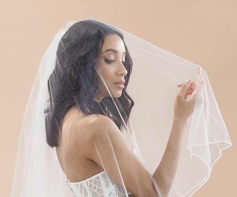 Woman wearing fingertip drop blusher veil with beaded edge - Jess by Laura Jayne Accessories Toronto
