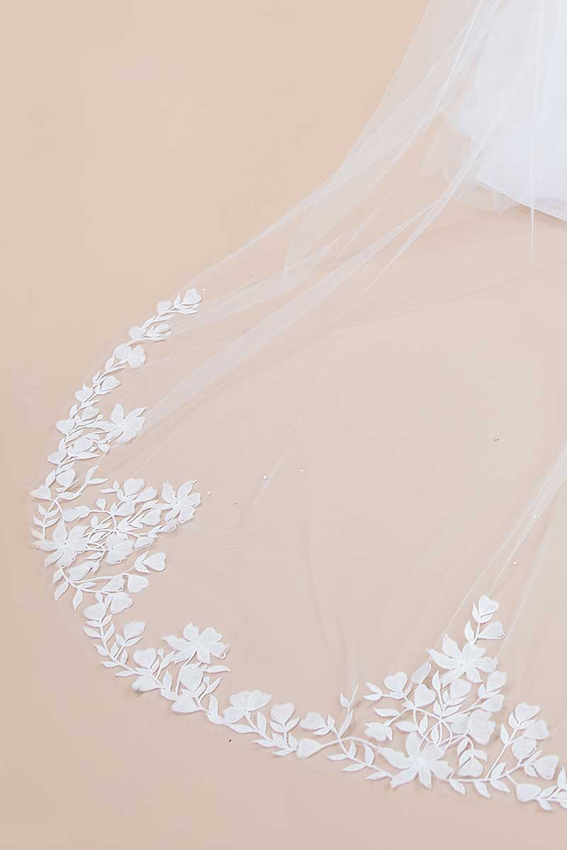 Closeup of border on floral embroidered cathedral veil with crystals and pearls. Nera 3D Flower Cathedral Veil by Laura Jayne Accessories Toronto. Handcrafted in Canada.