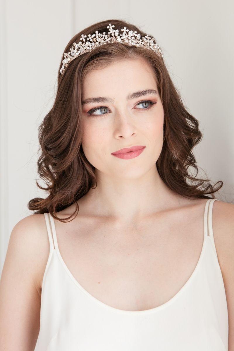 Romantic modern bride wearing crystal and pearl bridal crown with open lattice of flowers on an organza wrapped headband in rose gold tone. Adrienne Bridal Tiara. Handmade in Canada by Laura Jayne Accessories Toronto.