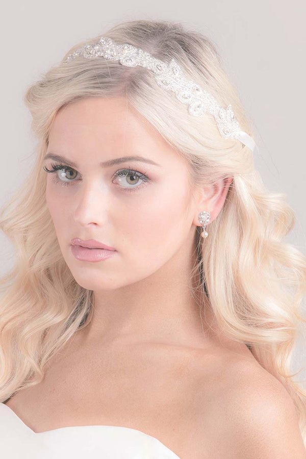 Bride wearing embroidered leaf bridal hair ribbon Sonnet by Laura Jayne