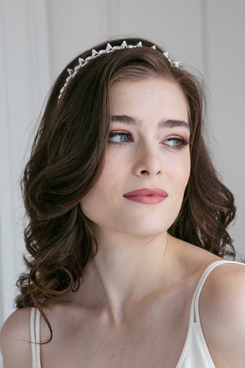 Woman wearing crystal spike modern bridal headband by Laura Jayne Accessories