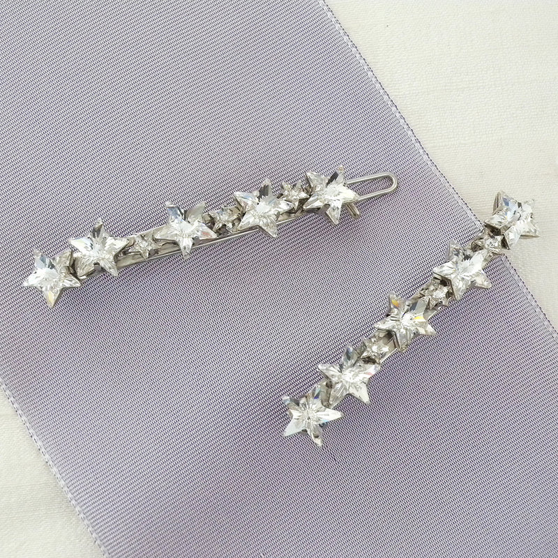 Pair of celestial crystal star barrettes by Laura Jayne Accessories