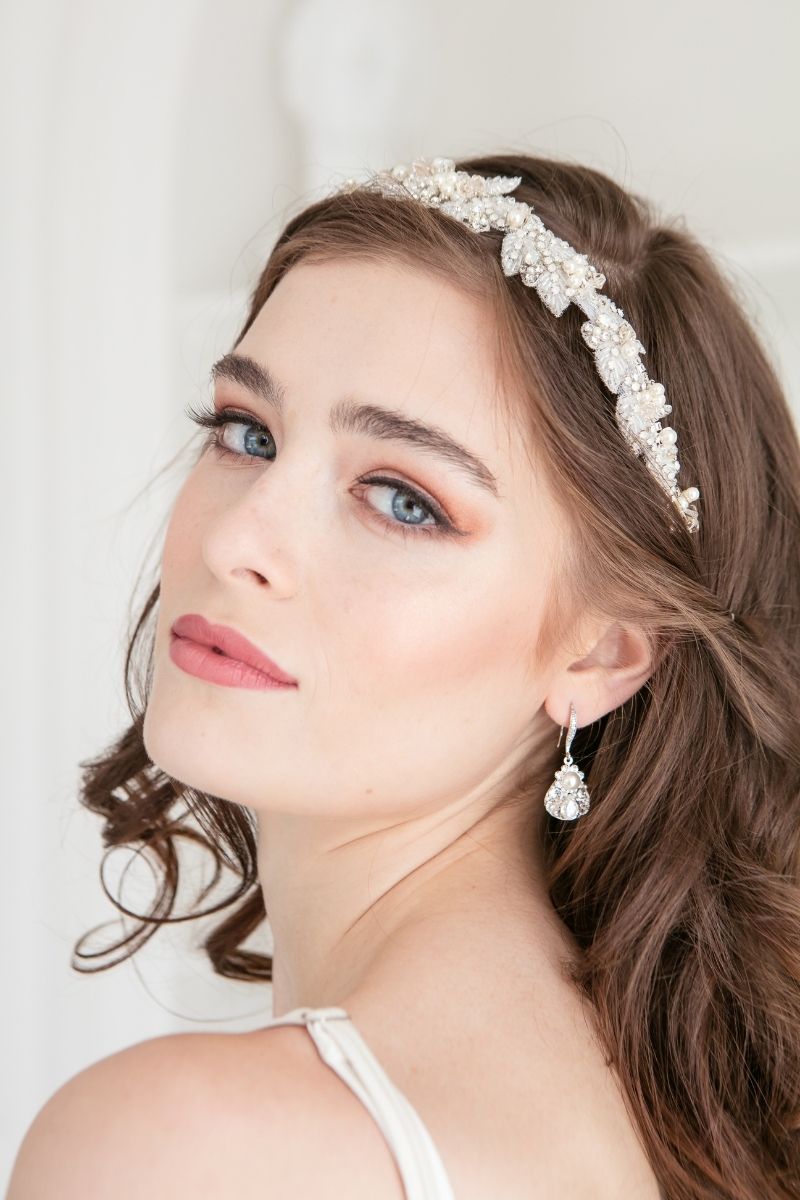 3/4 headshot of a bride showing one earring 