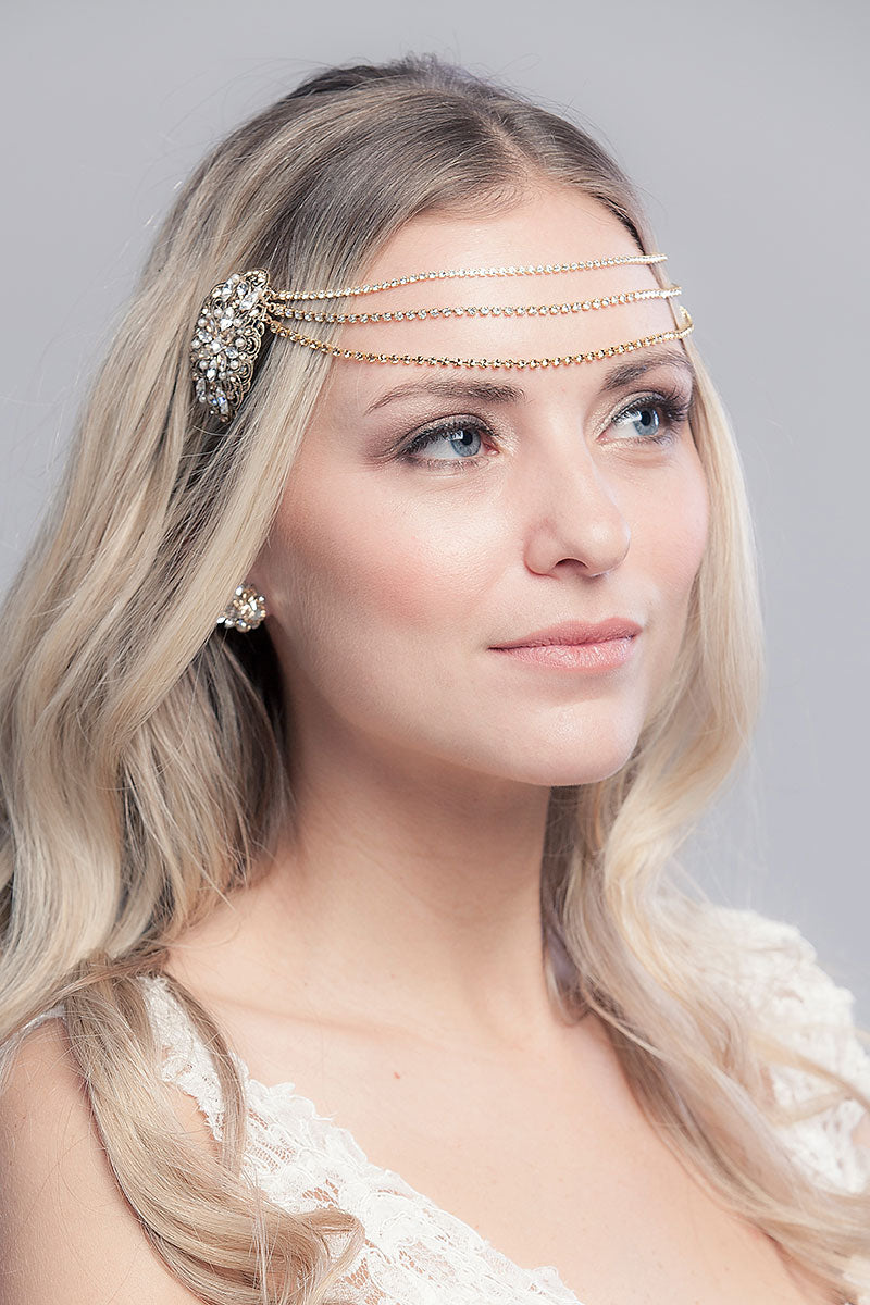 woman wearing draped chain forehead headpiece