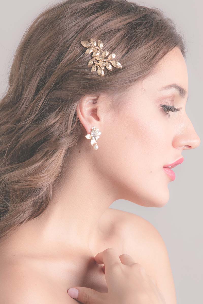 Profile of woman wearing Fauve gold leaf wedding hair accessory