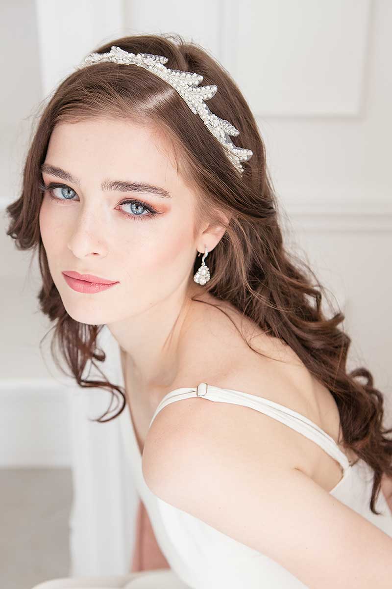 Bride wearing Ferra tulle pearl headband by Laura Jayne