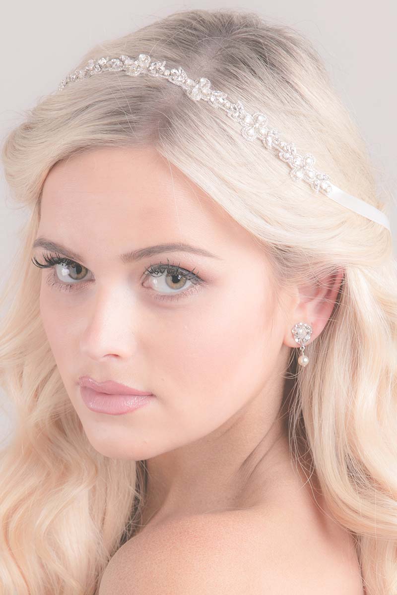 Head of woman wearing Carrie matte crystal bridal hair ribbon by Laura Jayne Accessories
