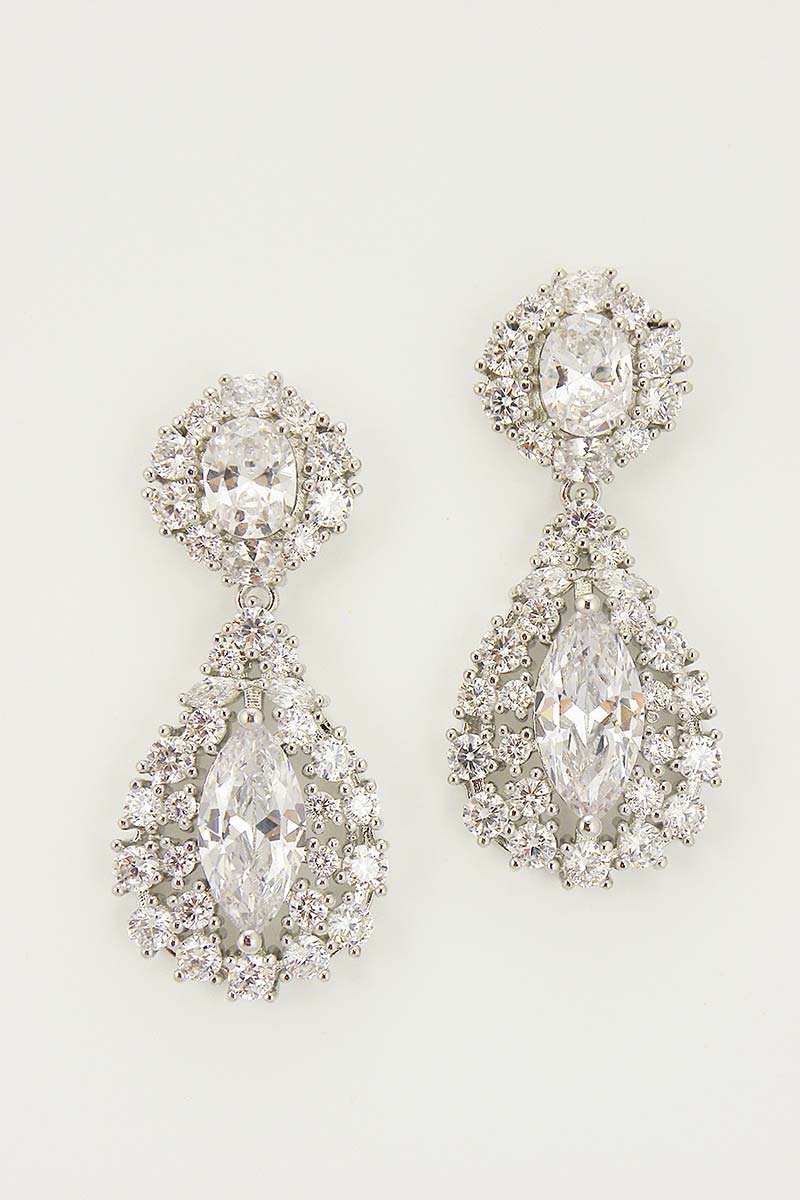 A pair of round-shaped earrings with central cubic zirconia stones surrounded by smaller accent stones, with rhodium plating and surgical steel posts.