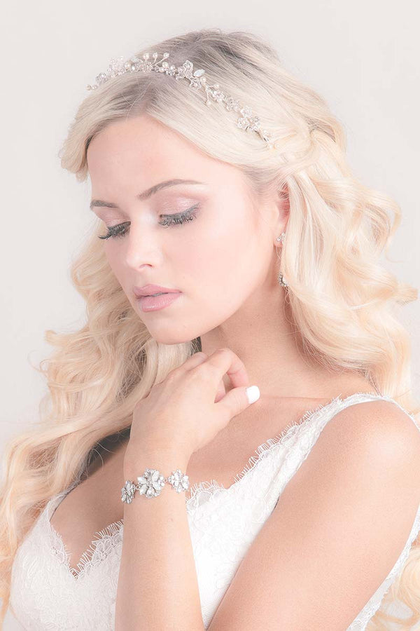 Bride looking down wearing crystal pearl hair vine Quin by Laura Jayne Accessories