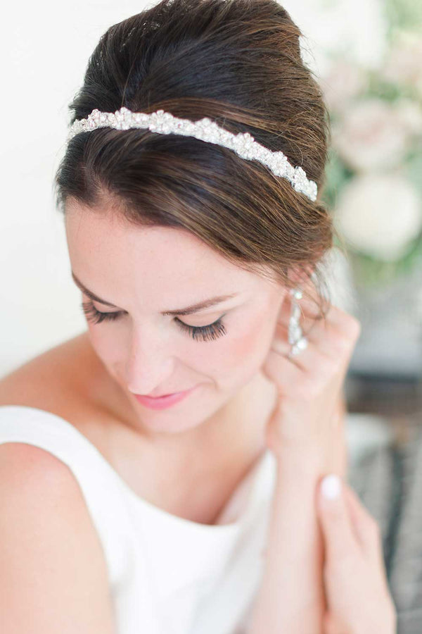 Head and shoulders of bride wearing beaded hair ribbon by Laura Jayne