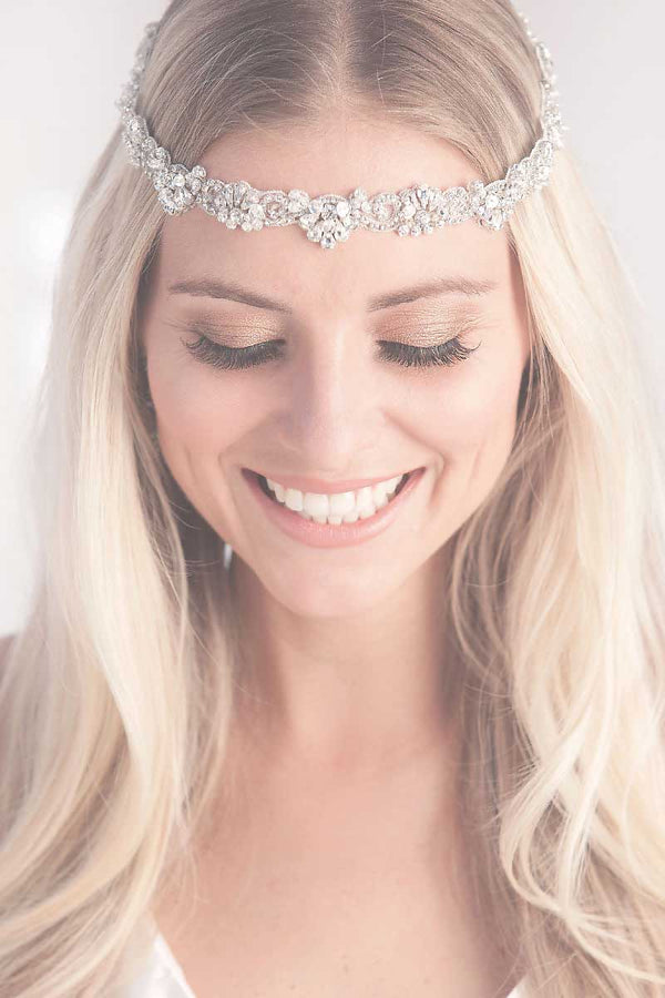 Model wearing Luna crystal wedding halo headpiece by Laura Jayne