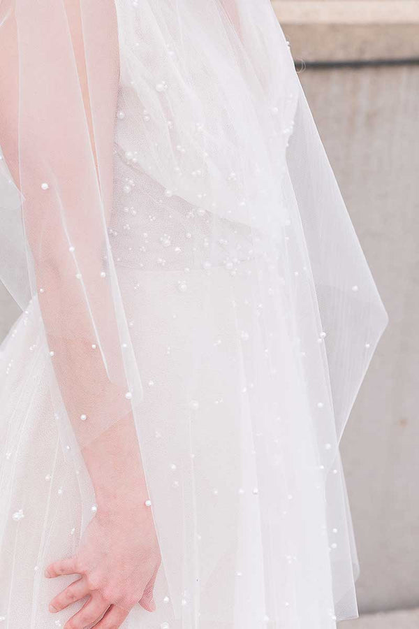 A closeup of the pearl details sprinkled on Pandora Pearl Fingertip Veil by Laura Jayne Accessories Toronto. Handcrafted in Canada.