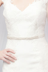 Torso of bride wearing pearl crystal Metropolitan wedding sash by Laura Jayne Accessories